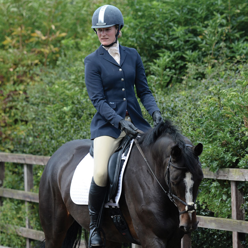girl riding in an arena